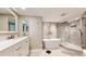 Luxurious bathroom with a soaking tub, walk-in shower, and double vanity at 25188 Marion Ave # D101, Punta Gorda, FL 33950