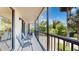 Spacious screened balcony with seating for two at 25188 Marion Ave # D101, Punta Gorda, FL 33950