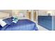 Bright bedroom with a blue comforter and plenty of closet space at 25188 Marion Ave # D101, Punta Gorda, FL 33950
