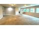 Finished basement with kitchenette and large windows at 1185 Bayshore Dr, Englewood, FL 34223