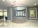 Unique circular living room with stained glass window at 1185 Bayshore Dr, Englewood, FL 34223