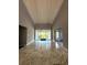 Spacious living room with marble floors and high ceilings at 1185 Bayshore Dr, Englewood, FL 34223