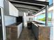Outdoor kitchen with granite countertop and appliances at 1185 Bayshore Dr, Englewood, FL 34223