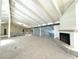 Open loft area with high ceilings and fireplace at 1185 Bayshore Dr, Englewood, FL 34223