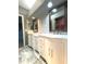 Modern bathroom with double vanity and marble flooring at 1185 Bayshore Dr, Englewood, FL 34223