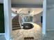Curved staircase in the grand foyer of the home at 1185 Bayshore Dr, Englewood, FL 34223