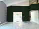 View into the living room through a green wall feature at 1185 Bayshore Dr, Englewood, FL 34223