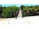 Wooden dock leading to the water at 1185 Bayshore Dr, Englewood, FL 34223