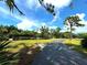 Long driveway leading to a home at 1185 Bayshore Dr, Englewood, FL 34223