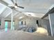 Loft area with high ceilings, spiral staircase, and chandelier at 1185 Bayshore Dr, Englewood, FL 34223