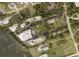 Aerial view of property showing land and tennis court at 1185 Bayshore Dr, Englewood, FL 34223