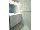 Updated bathroom with modern vanity and marble flooring at 1185 Bayshore Dr, Englewood, FL 34223