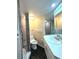Updated bathroom with shower, toilet, and vanity at 1185 Bayshore Dr, Englewood, FL 34223