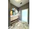 Modern bathroom with updated vanity and large window at 1185 Bayshore Dr, Englewood, FL 34223