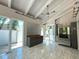 Modern kitchen with gray cabinets, granite counters, and access to a patio at 1185 Bayshore Dr, Englewood, FL 34223