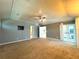 Main bedroom with carpet, double doors, and access to bathroom at 1185 Bayshore Dr, Englewood, FL 34223