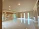 Large living area with a raised platform and access to the pool at 1185 Bayshore Dr, Englewood, FL 34223