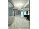 Open living area with pool view and marble flooring at 1185 Bayshore Dr, Englewood, FL 34223