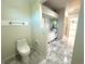 Spacious bathroom with marble flooring and modern vanity at 1185 Bayshore Dr, Englewood, FL 34223
