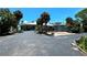 Two-story waterfront home with circular driveway at 1185 Bayshore Dr, Englewood, FL 34223