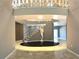 Elegant entryway with a circular staircase and marble flooring at 1185 Bayshore Dr, Englewood, FL 34223