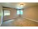 Spacious bedroom with two windows and carpet flooring at 1185 Bayshore Dr, Englewood, FL 34223