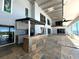 Outdoor kitchen with granite countertop and grill at 1185 Bayshore Dr, Englewood, FL 34223