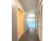 Long hallway with access to bedroom and bathroom at 1185 Bayshore Dr, Englewood, FL 34223