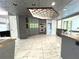 Kitchen boasts gray cabinets, granite counters, and a stylish backsplash at 1185 Bayshore Dr, Englewood, FL 34223