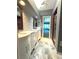 Updated bathroom with double vanity and walk-in shower at 1185 Bayshore Dr, Englewood, FL 34223