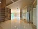 Living room with built-in shelving and mirrored accent wall at 1185 Bayshore Dr, Englewood, FL 34223