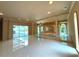 Living room with pool access and a raised platform area at 1185 Bayshore Dr, Englewood, FL 34223