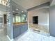 Modern wet bar with gray cabinets and granite countertop at 1185 Bayshore Dr, Englewood, FL 34223