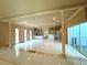 Spacious living room with high ceilings and marble floors at 1185 Bayshore Dr, Englewood, FL 34223