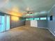 Large bedroom with carpet, ceiling fan, and multiple windows at 1185 Bayshore Dr, Englewood, FL 34223