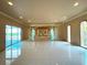 Living room with pool access and a raised platform area at 1185 Bayshore Dr, Englewood, FL 34223