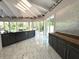 Sun-drenched kitchen with expansive windows and marble flooring at 1185 Bayshore Dr, Englewood, FL 34223