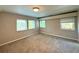 Bright bedroom with neutral walls and carpet flooring at 1185 Bayshore Dr, Englewood, FL 34223
