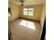 Simple bedroom with tiled floors and a window at 21098 Glendale Ave, Port Charlotte, FL 33952