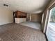 Open living area with tile floors and a bar at 21098 Glendale Ave, Port Charlotte, FL 33952