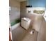 Partially remodeled bathroom with new vanity at 21098 Glendale Ave, Port Charlotte, FL 33952