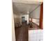 A fixer-upper kitchen with tiled floors and partial walls at 21098 Glendale Ave, Port Charlotte, FL 33952