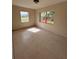 Spacious bedroom with tiled floors and large window at 21098 Glendale Ave, Port Charlotte, FL 33952
