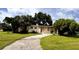 Ranch-style home with a large yard and driveway at 21098 Glendale Ave, Port Charlotte, FL 33952