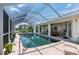 Screened-in, heated pool with brick pavers at 1425 Pine Island Ct, Punta Gorda, FL 33950