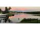 Boat docked, sunset over canal at 1425 Pine Island Ct, Punta Gorda, FL 33950