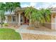 Front entrance of the house with double doors and palm trees at 378 Monaco Dr, Punta Gorda, FL 33950