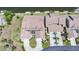 Aerial view of the house with a tile roof, screened in patio, and an attached two-car garage at 3800 Bal Harbor Blvd # 212, Punta Gorda, FL 33950