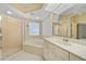 Well-appointed bathroom with dual vanity, a walk-in shower, and a relaxing jetted tub for spa days at 3800 Bal Harbor Blvd # 212, Punta Gorda, FL 33950