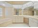 Luxurious bathroom with a jetted tub, a separate shower, dual sinks, and a vanity area at 3800 Bal Harbor Blvd # 212, Punta Gorda, FL 33950